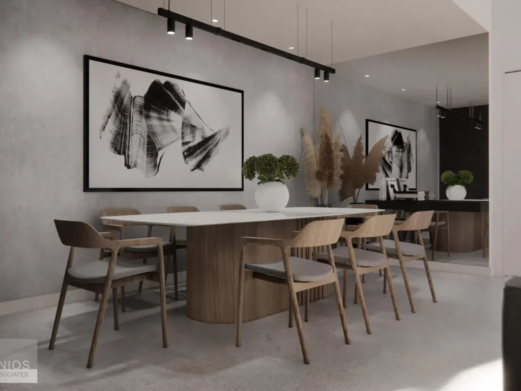 Dining area with timber table, designer chairs and large abstract artwork