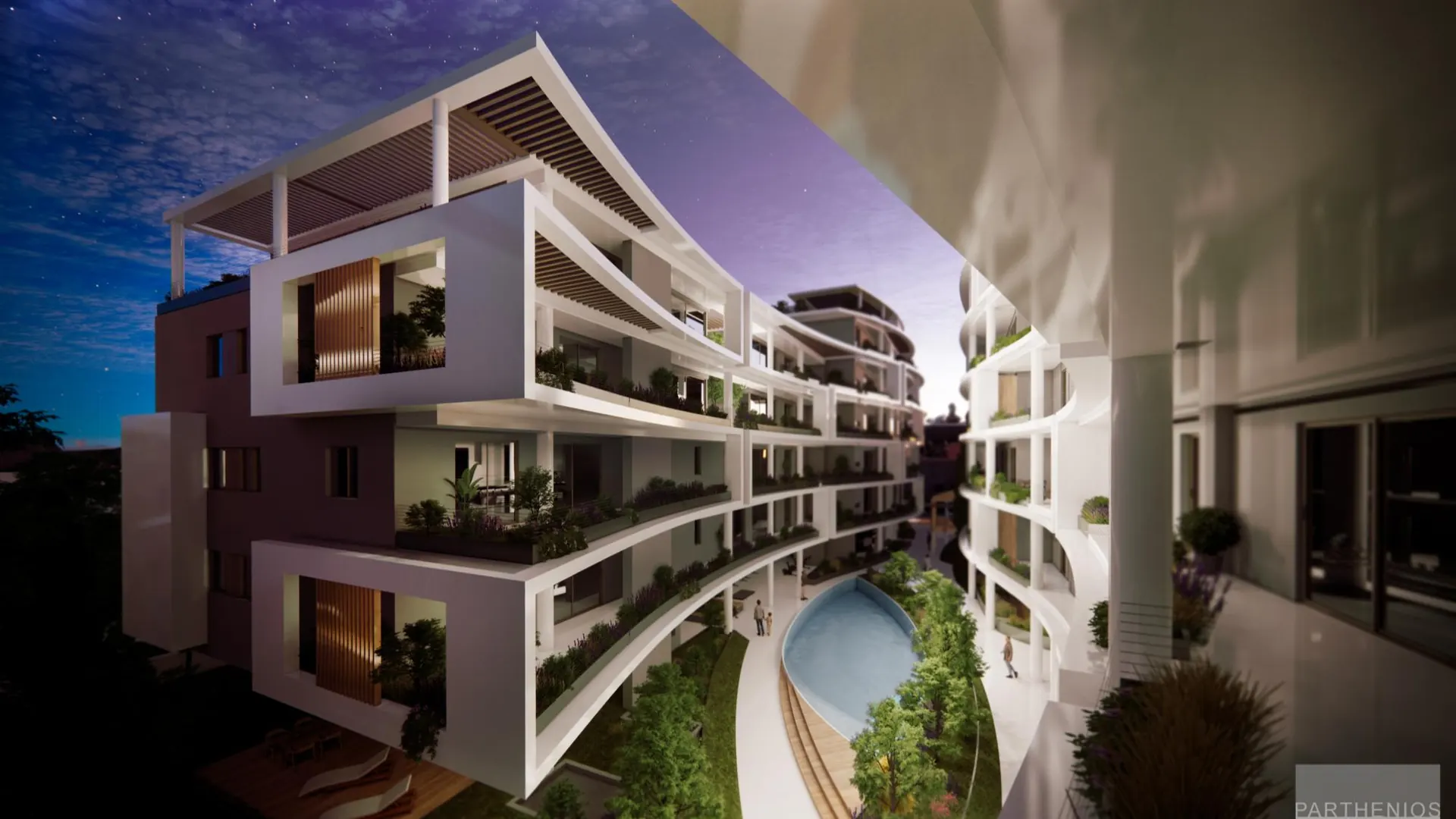 Platonos Gardens at dusk with curved white balconies, lit terraces and the courtyard pool