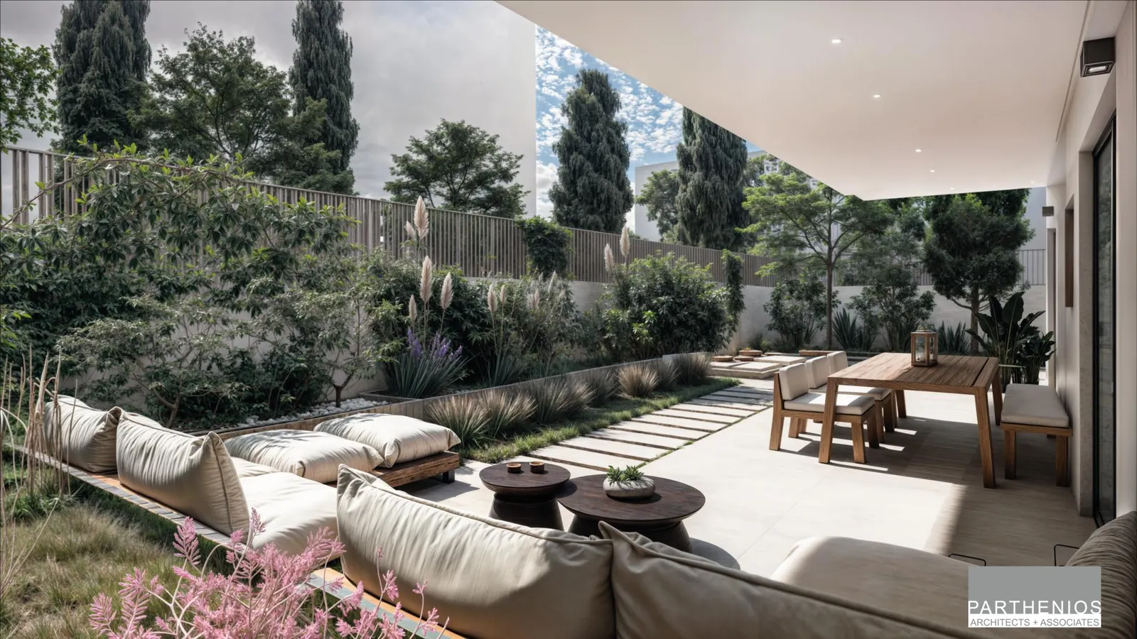 Garden terrace with outdoor seating framed by olive trees and flowering plants