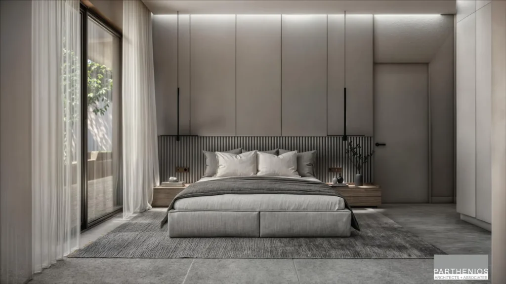 Master bedroom with upholstered headboard, warm indirect lighting and a balcony door